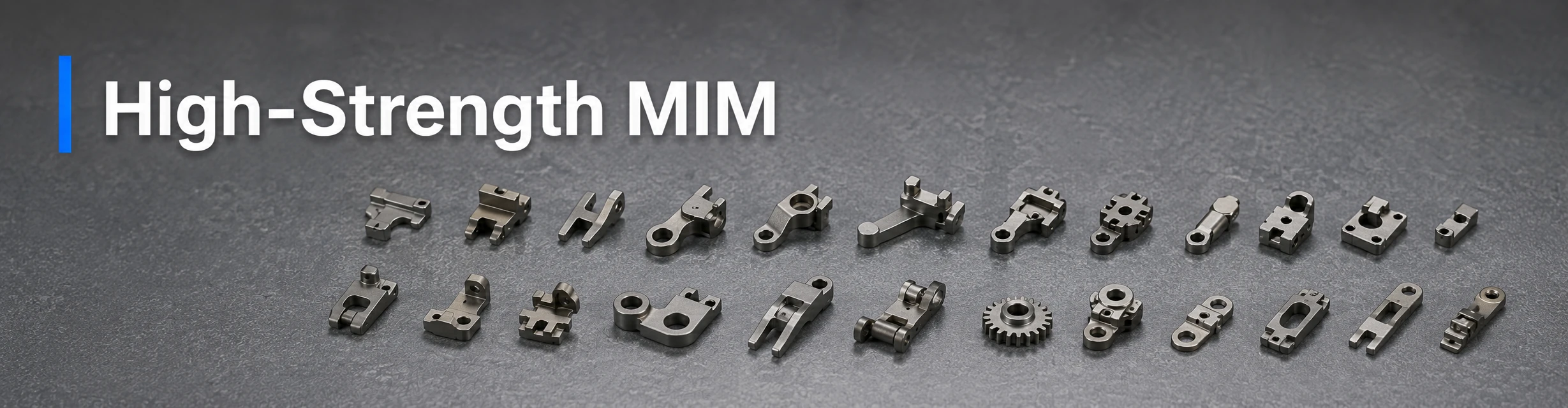 Small complex high-strength MIM components arranged in a batch tray for material selection review.