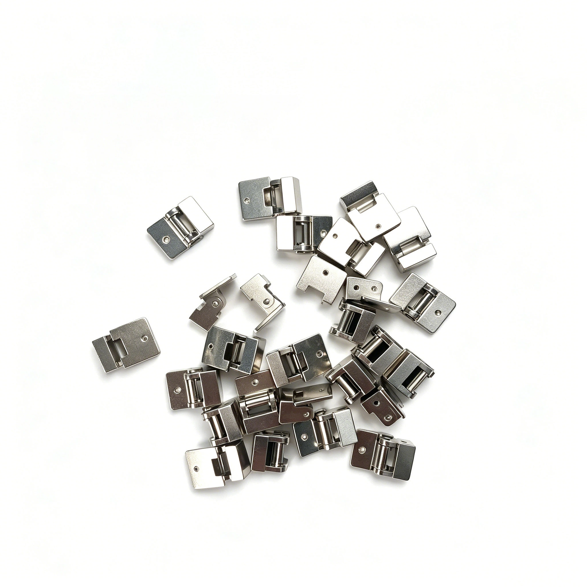 Precision MIM hinge parts arranged as a product showcase, showing compact rectangular hinge components for small electronic assemblies.